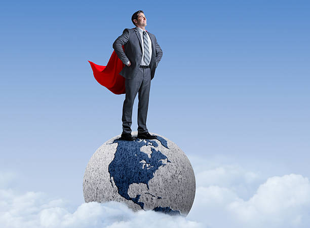 istock Superhero Businessman Standing On Globe 479408066