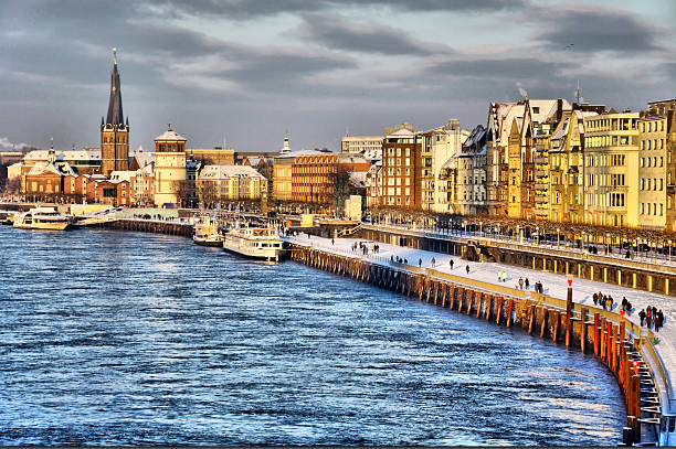 Beautiful shore of Rhein river during day in Dusseldorf Beautiful shore of Rhein river during day in Dusseldorf in winter, Nordrhein-Westfalen, Germany düsseldorf stock pictures, royalty-free photos & images