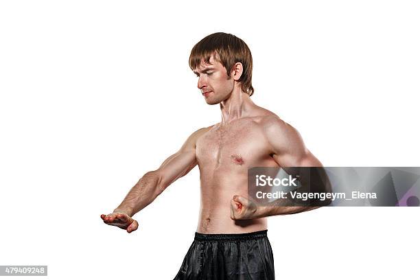 Fighter Kung Fu Puts Block Lower Kick Stock Photo - Download Image Now - 2015, Activity, Adult