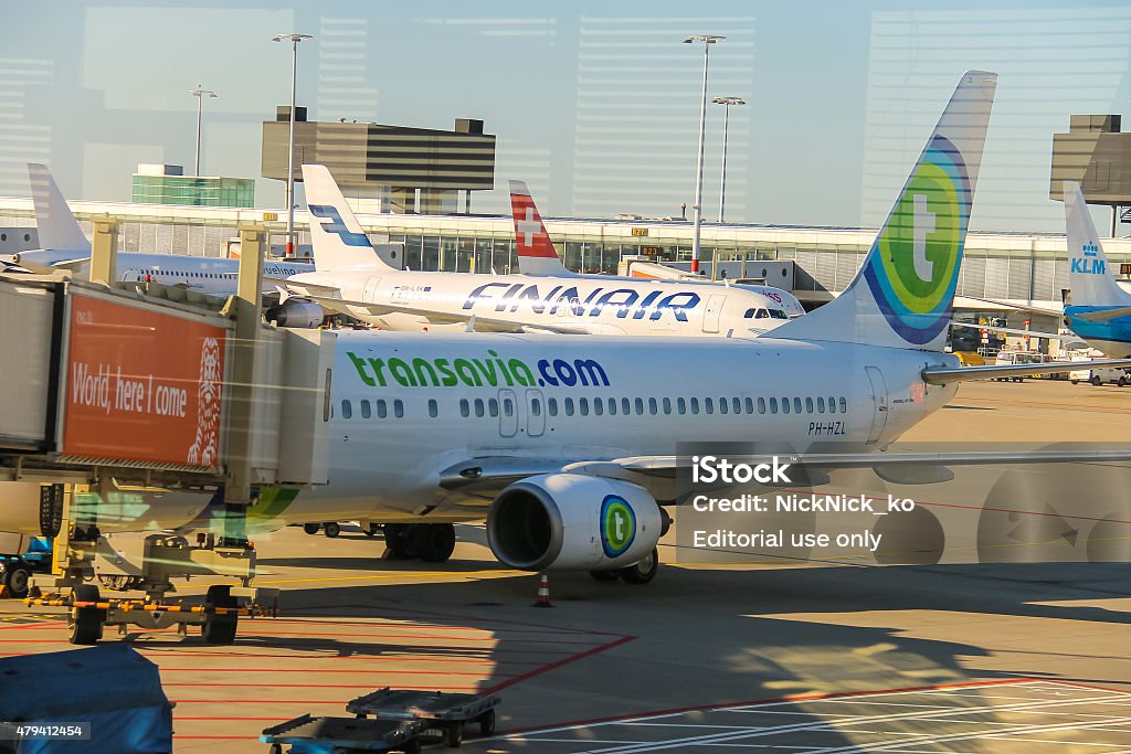 Maintenance of aircraft on the airfield at the airport Amsterdam Amsterdam Schiphol, Netherlands - April 18, 2015:  Maintenance of aircraft on the airfield at the airport Amsterdam Schiphol, Netherlands 2015 Stock Photo