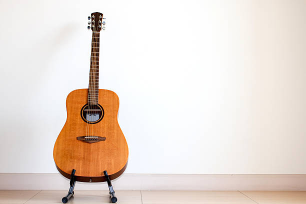 istock Acoustic guitar with guitar stand 479412530