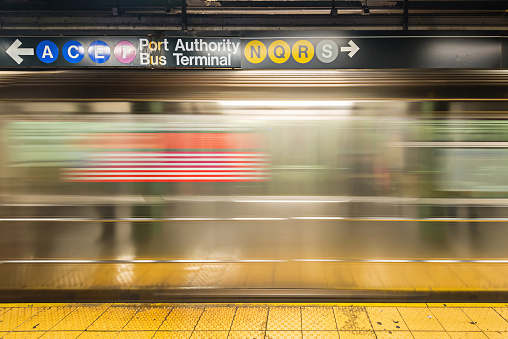 Queensboro Plaza Subway Station, Queens, New York, USA - August 18th 2023:   Subway train at the platform at a elevated station