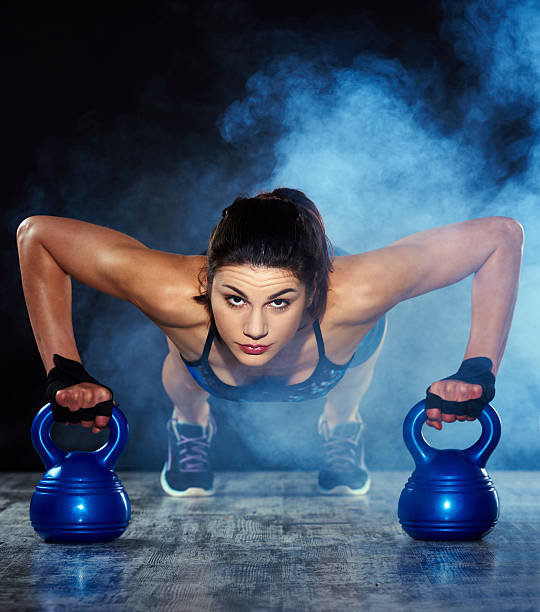 istock fitness woman making push ups 479413382