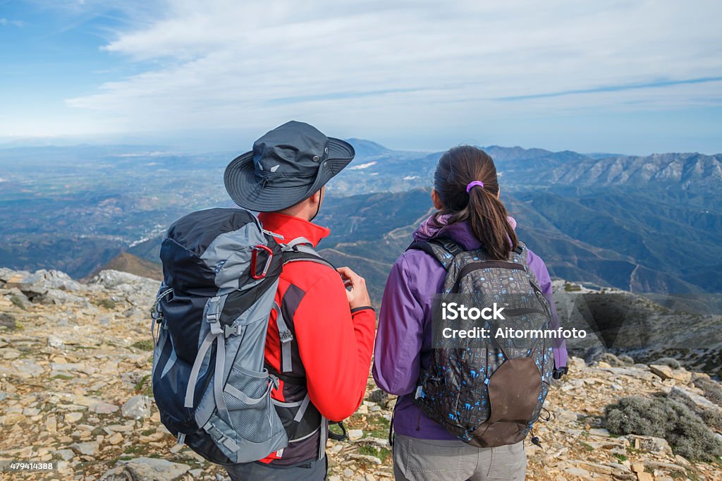 Couple enjoying the mountains Couple looking at views at the mountain. Enjoying the nature 2015 Stock Photo