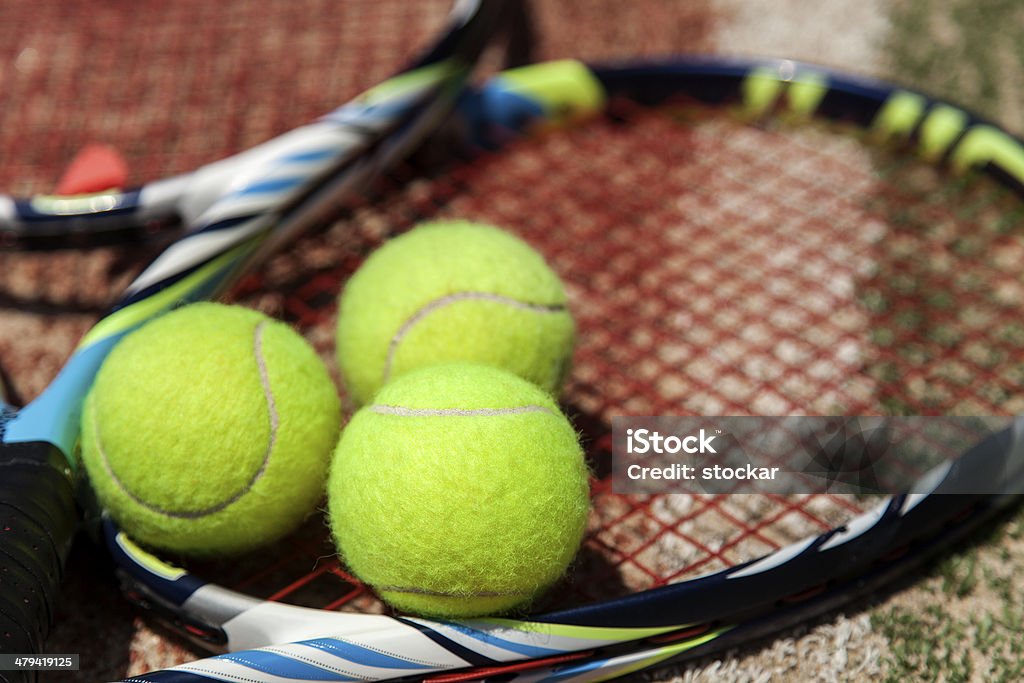 Tennis ball and racquet on the court Horizontal Stock Photo