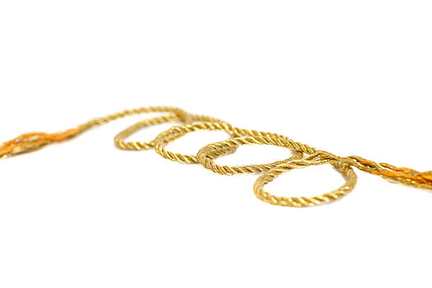 istock golden rope isolated on white background 479419338