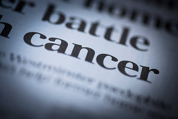 Cancer written newspaper. stock photo
