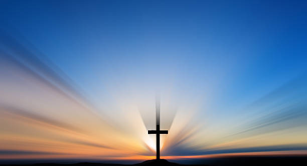 istock Cross on the hill behind the blur sunset. 479422270