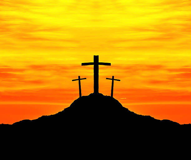 istock Cross on the hill behind the blur sunset. 479422306