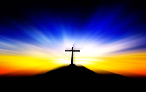 istock Cross on the hill behind the blur sunset. 479422964