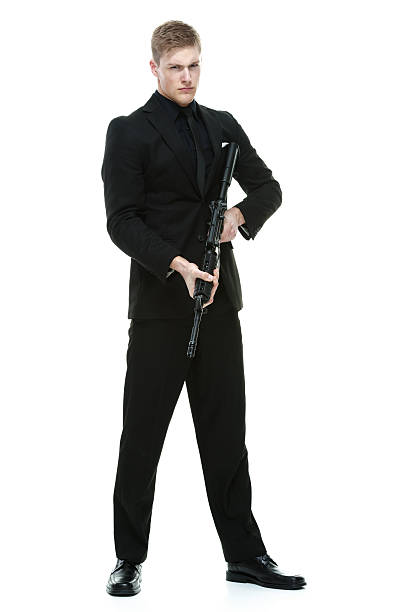 istock Businessman standing with machine gun 479423169