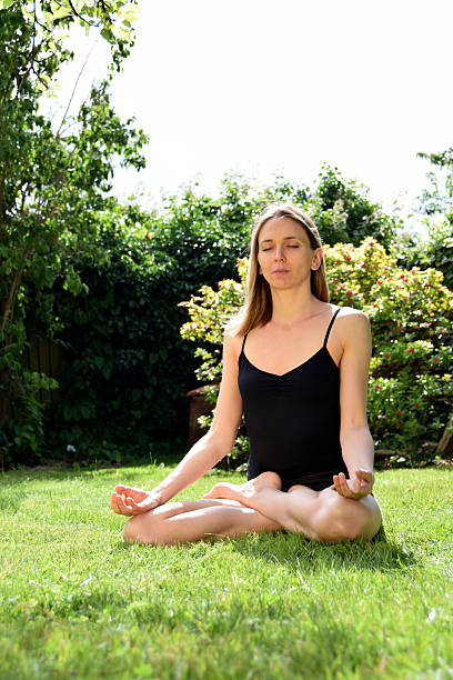 istock Yoga woman outdoors – Lotus pose (padmasana) 479423642