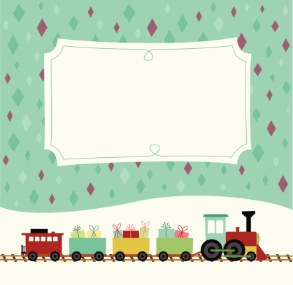A colorful retro styled toy train carrying little presents travels in the snow in front of a decorative placard.