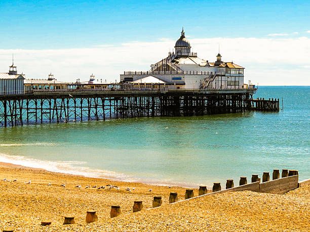 Eastbourne Pier and beach Eastbourne Pier and beach, East Sussex, England, UK eastbourne pier photos stock pictures, royalty-free photos & images