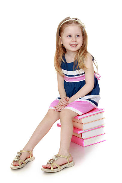 istock The child sits on the books 479427248