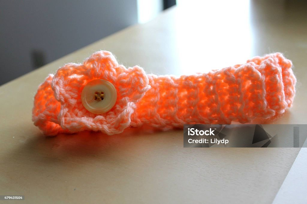 Crocheting Headband It's handmade headband for a baby. 2015 Stock Photo