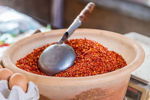 istock Red dried chilli in plastic basket on Chinese market 479431658