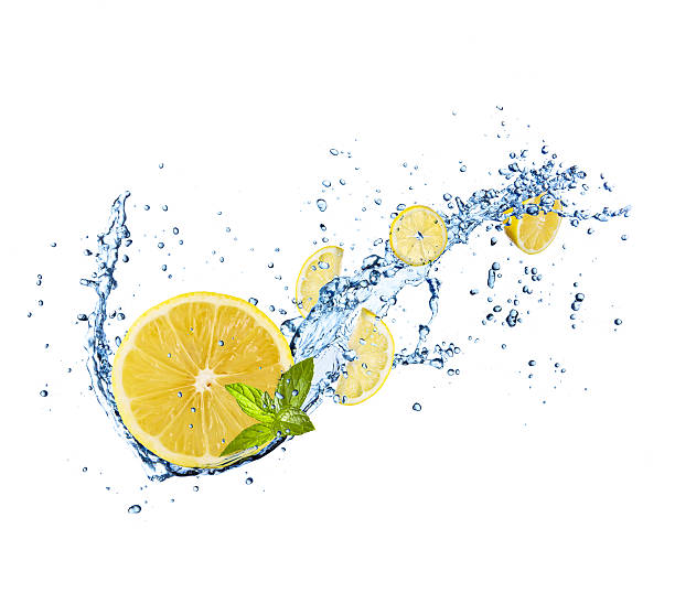 istock Pieces of lemons in water splash on white 479435672