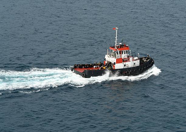 istock Tugboat sailing in the sea against the ship 479435780