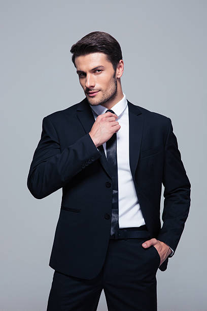 istock Handsome businessman straightening his tie 479436026