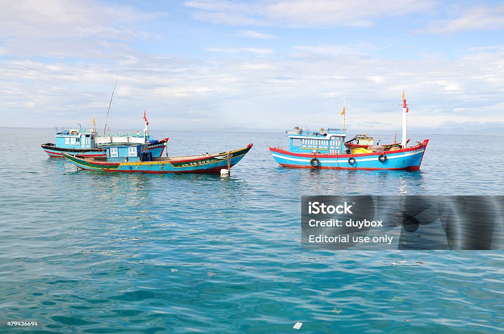 Fishing boats are mooring together in the sea Quang Ngai, Vietnam - July 31, 2012: Fishing boats are mooring together in the sea 2015 Stock Photo