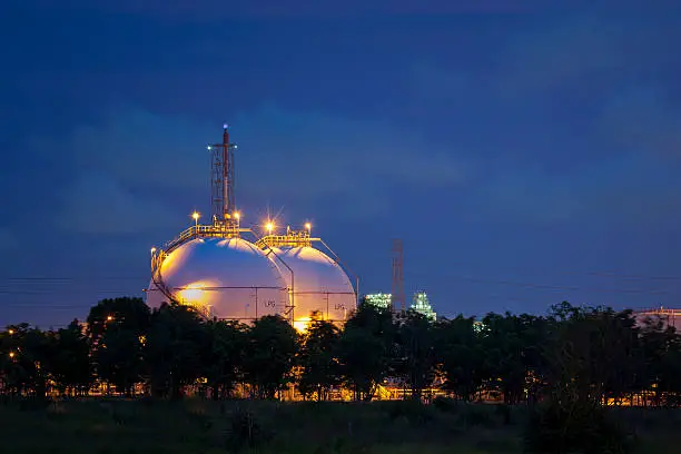 Photo of Natural Gas Tanks at twilight
