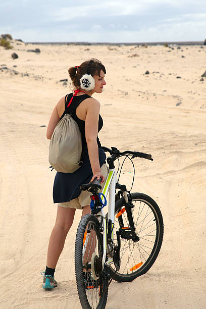 istock Young woman with bike 479440715