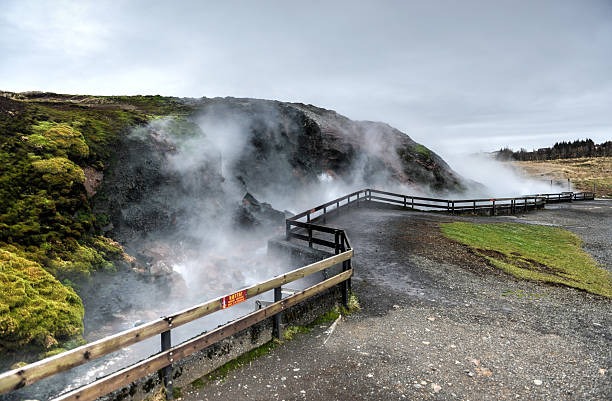 Deildartunguhver Geothermal Spring, Iceland Deildartunguhver, a geothermal hotspring in Reykholtsdalur, Iceland. It has a very high flow rate for a hot spring and water emerges at near boiling. It is the highest-flow hot spring in Europe. golden circle route photos stock pictures, royalty-free photos & images