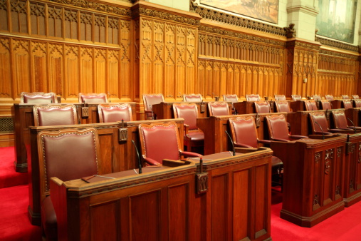 Chairs and desks in the Red Senate Chamber of the Canadian Parliament - Parliament Hill, Ottawa, Canada. See more in my portfolio.