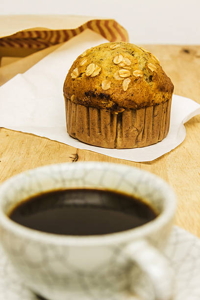 istock Almond muffins with coffee cup on wood table 479441707