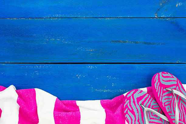 istock Blank beach sign with towel and flip flops 479442960