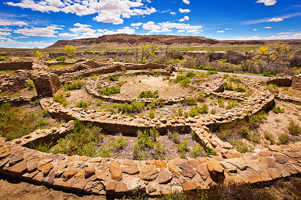 Spiritual Kiva in Chaco Canyon National Historical Park, New Mexico The Kiva, a spiritual site in The Chaco Culture National Historical Park in New Mexico. A famous ancient Pueblo site featuring architectural ruins of homes, food storages, spiritual kivas and villages built in the ancient adobe style architecture. Photographed on location in the National Park in horizontal format. chaco culture national historic park stock pictures, royalty-free photos & images