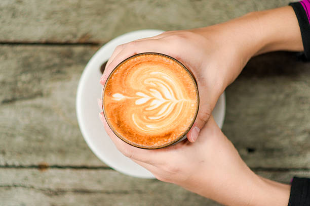 istock Female hand holding hot cup of coffee 479449228