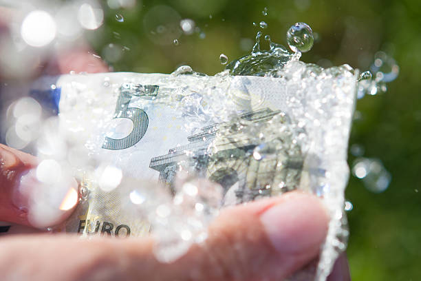 Washing 5 euro banknote.