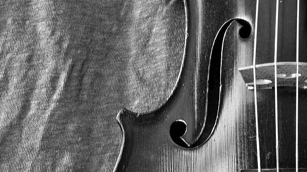 istock Antique violin and linen black and white closeup 479454200