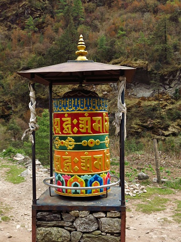 Colorful prayer wheel. Buddhist mantra.