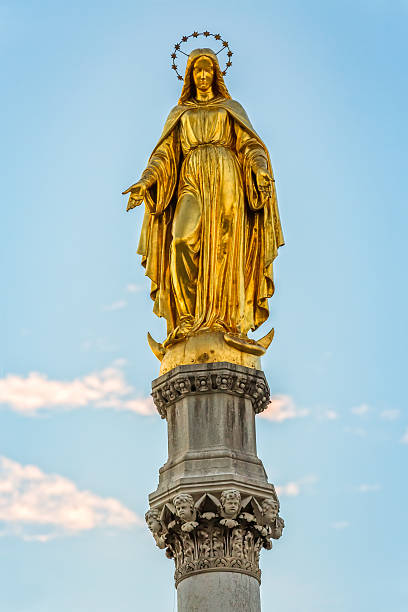 istock Virgin Mary golden statue 479463234