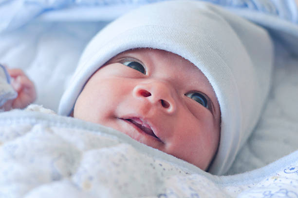 Cute little newborn giving a smile