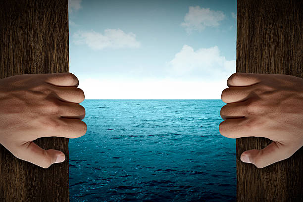 Man hand open door into the sea