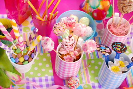 colorful birthday party table with homemade sweets for kids ( top view)