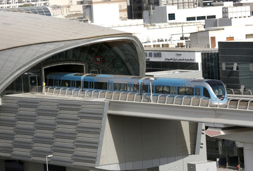Dubai, United Arab Emirates - September 03, 2011: Train moving out from a metro station in Dubai.