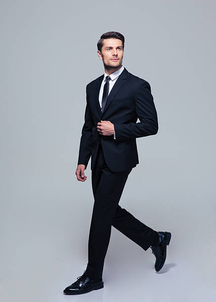 istock Businessman walking over gray background 479469590