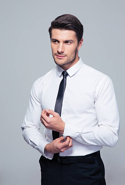istock Handsome businessman buttoning shirt 479469610