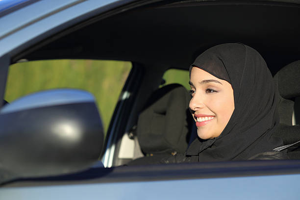istock Happy arab saudi woman driving a car 479473475