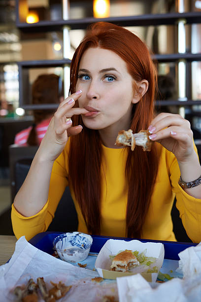 istock licking my fingers after chicken drumsticks 479474554