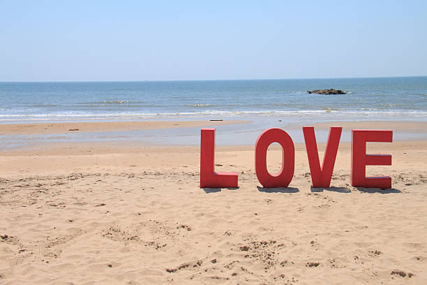 istock word love on the beach 479478838