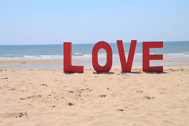 istock word love on the beach 479478840