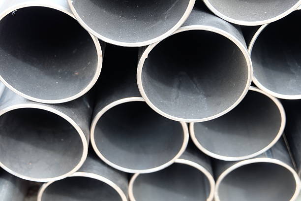 istock steel pipes on black and white 479483314