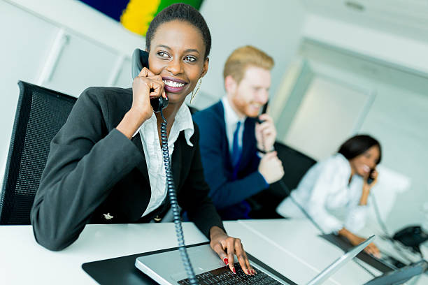istock Beautiful, black, young woman working at a call center 479483790