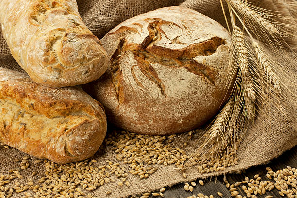 istock Assortment of baked bread on wood table 479483897